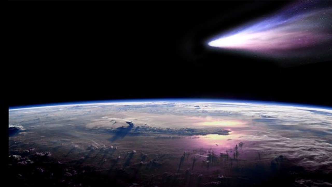 ilustrasi sebuah komet melintas di atas planet bumi. (net)