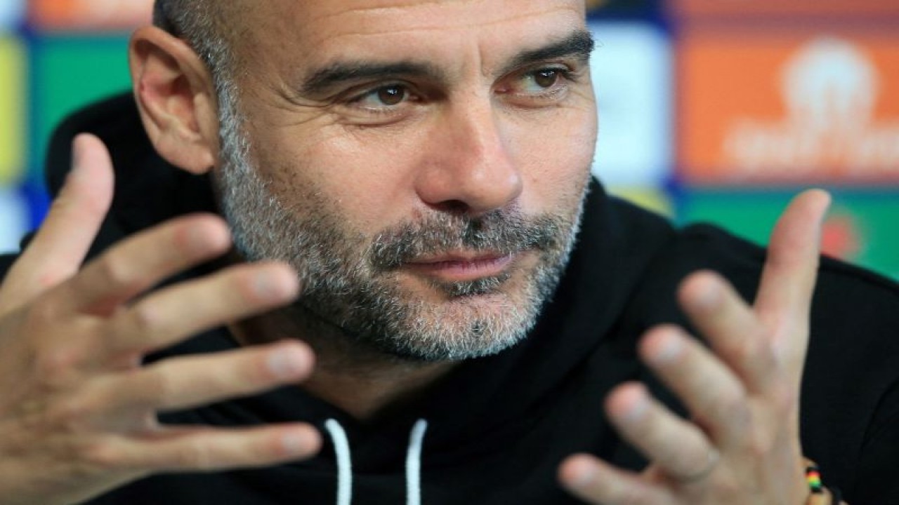 Pelatih Manchester City asal Spanyol Pep Guardiola dalam konferensi pers di Etihad Stadium di Manchester. (Photo by Lindsey Parnaby / AFP) (AFP/LINDSEY PARNABY)