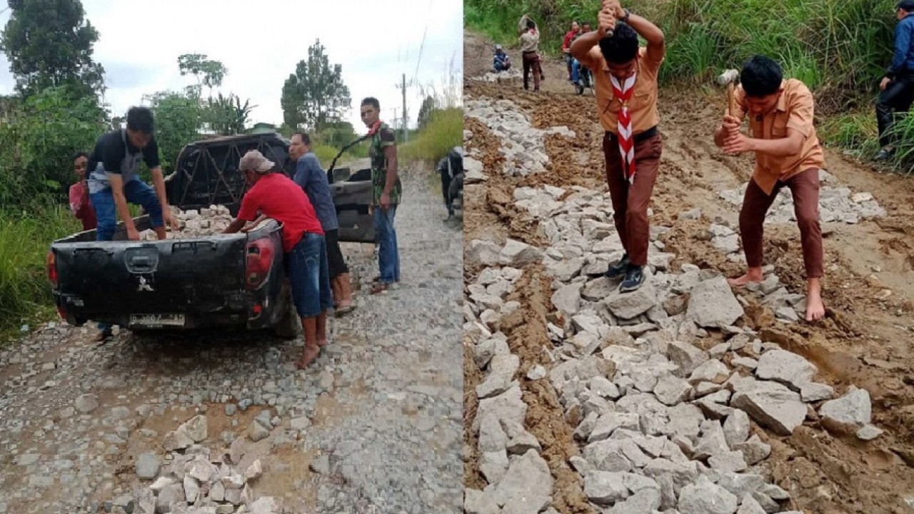 Warga dan siswa di Kecamatan Habinsaran, Borbor, dan Nassau di Kabupaten Toba, Sumatera Utara bergotong royong menimbun jalan yang rusak berat dengan batu agar bisa dilalui kendaraan/ist   